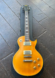Vintage V100 Lemon Drop les paul electric guitar , orange finish, with nickel hardware, rosewood fretboard, trapezoid inlays and black headstock