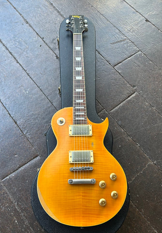 Vintage V100 Lemon Drop les paul electric guitar , orange finish, with nickel hardware, rosewood fretboard, trapezoid inlays and black headstock