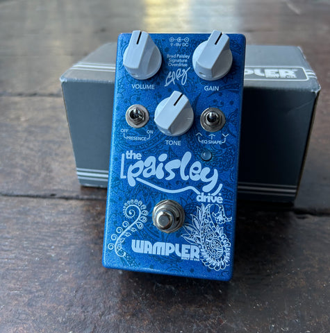 Wampler blue pedal with Paisley scrip and Wampler script , three knobs white, gain, volume, tone