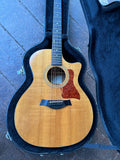 Close Up:aylor acoustic spruce top, with cutaway, tortoise pick guard, ebony bridge