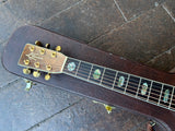 Close up, Alvarez rosewood hearstock with gold machine tuners, Alvarez logo, ebony fretboard with hexagon abalone inlays