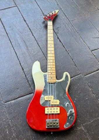 Hondo Fame 861 Series Bass red and grey sparkle finish, with mirror pickguard, maple neck, red and grey headstock