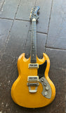 A vintage-style electric guitar Orpeus with a yellow-orange sunburst finish, black pickguard, and chrome hardware, photographed from above on a dark wooden floor.