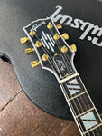 Close up headstock with Gibson script , gold tuners