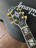 Close up headstock with Gibson script , gold tuners