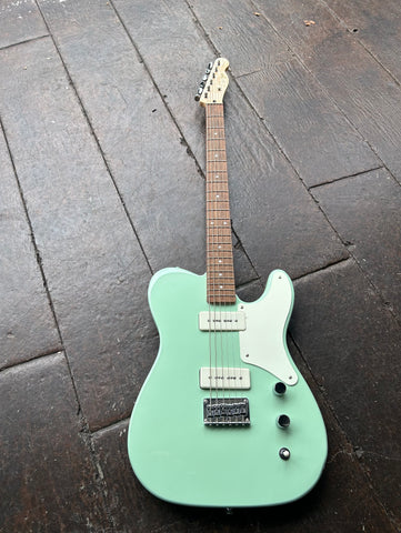 Top view Surf green Telecaster Squier Baritone guitar with white P-90's. wood fretboard, dot inlays, Squier script on wood color headstock
