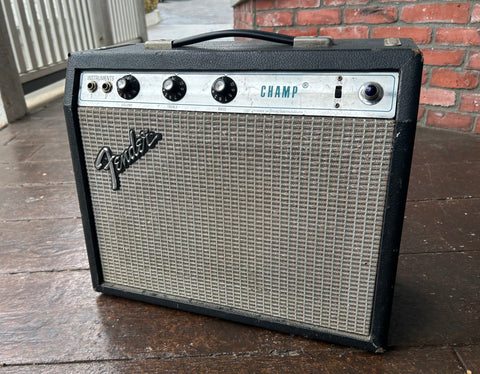 Fender Champ amplifier, black tolex, grey grill cloth, metal control panel with three knob controls