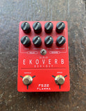 Red guitar effects pedal with knobs and two button footswitches