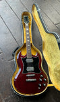 Top View Greco burgundy SG win yellow case. Two humbucker chrome pick ups, roswood pick ups, dark pearl block inlays, black headstock with Grecco script