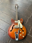 Red finish Harmony Rocket, two pick ups, with bigsby, rosewood neck and brown headstock