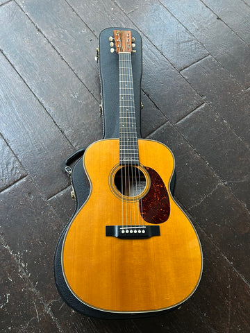 Martin 000-28EC Eric Clapton acoustic guitar, dark spruce finish, with ebony bridge and fretboard, rosewood headstock