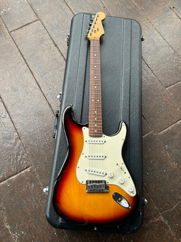 top view Fender Tobacco sunburst , with white pick guard and white pick ups, metal tremolo, rosewood fretboard with dot  fret markers, maple headstock with Fender writing