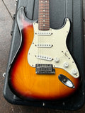 Close up Fender body tobacco sunburst with white pick guard, white pick up covers, metal bridge, white knobs
