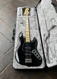 top view black fender jazz bass, with maplle neck, black perloid block inlays, maple headstock, metal tuners