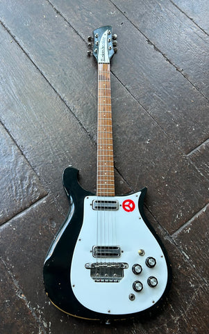 1966 Rickenbacker Model 450 electric guitar with black finish, white pickguard, two pickups rosewood fretboard and black headstock