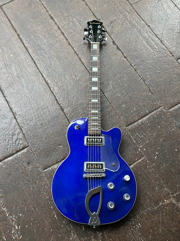 Blue DeArmond electric solid body guitar with chrome hardware and rosewood fretboard, black headstock
