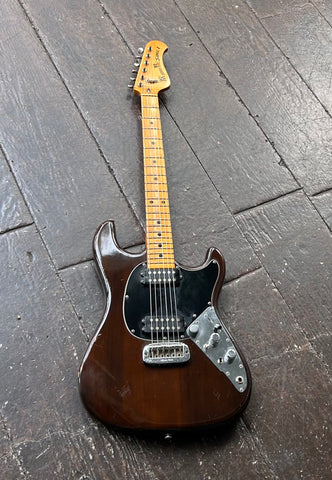 Music Man Sabre 1 Walnut finish electric guitar, with maple neck and headstock
