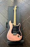 Pink pearl parts Stratocaster with black pick-guard and maple neck and headstock