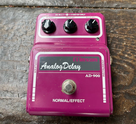 light purple Analog Delay AD-900 effects pedal with three black control knobs and single button footswitch