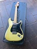 Top View Fender light green with black pickguard with maple fret board, black dot inlays, fender dark maple headstock