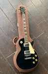 top view black gibson les paul, chrome pick ups, rosewood fretboard with trapezoid inlays