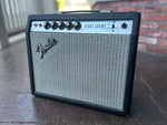 1979 Fender Vibro Champ guitar amplifier, black tolex, grey grill cloth, silver control panel, with five control knobs. 