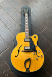 1999 DeArmond Guild X155, natural top arch-top with rosewood fretboard and block pearl inlays, black headstock
