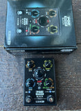 A Line 6 POD Express Black distortion pedal and its original retail box, displayed on a dark wooden surface.