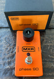 Orange MXR Pedal ingle control knob, on wooden floor with packaging 
