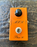 Orange MXR Phase 90 guitar effects pedal single black knob on a textured surface