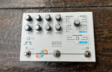 Microcosm Hologram white/silver guitar pedal with seven control knobs and three foot switch controls 