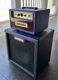 Panama guitar head purple with 1x12 black cabinet on wooden surface