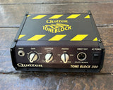 Quilter Tone Block 200
 black and yellow mini guitar head with three control knobs