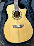 A natural wood cutaway acoustic guitar resting inside an open black instrument case.