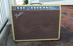 front tweed enclosure, brown cloth with fender logo, black control panel with white knobs